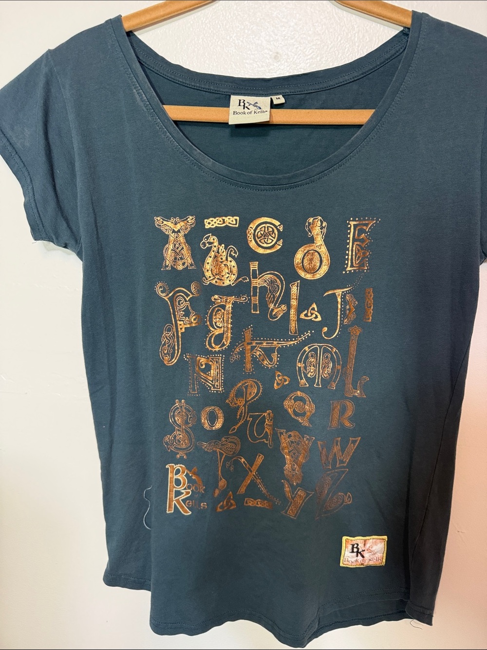 Book of Kells Teal Short Sleeve Graphic Tee with Gold Print